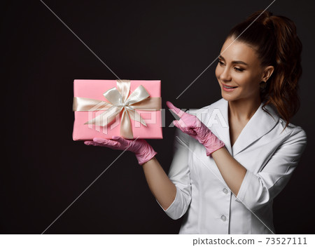 Woman doctor gynecologist reproductologist in pink Woman doctor gynecologist reproductologist in pink 73527111