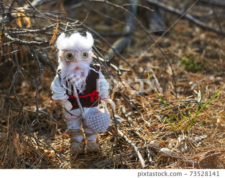 Leshy in traditional Russian clothes, with a bag in which there is bread. Leshy in traditional Russian clothes, with a bag in which there is bread. 73528141