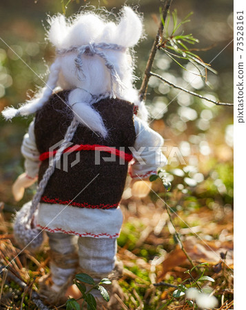 Leshy in traditional Russian clothes, with a bag in which there is bread. Leshy in traditional Russian clothes, with a bag in which there is bread. 73528161