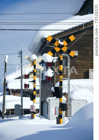 Railroad crossing buried in the snow Railroad crossing buried in the snow 73528335