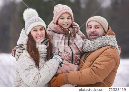 Happy Family Portrait Outdoors in Winter Happy Family Portrait Outdoors in Winter 73528439