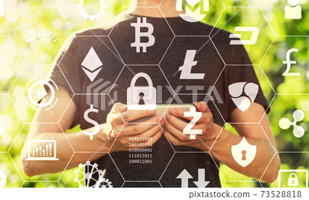 Cryptocurrency with man holding his smartphone Cryptocurrency with man holding his smartphone 73528818
