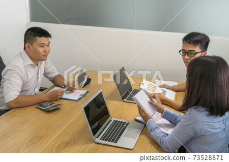 Businessman and teammate discuss about work in office Businessman and teammate discuss about work in office 73528871