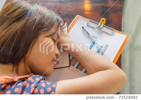 Top view photo of overworked woman fall asleep at office 73528892