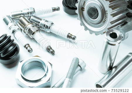 Spark plugs. Auto motor mechanic spare or automotive piece on white background. Set of new metal car part. Repair and vehicle service. Spark plugs. Auto motor mechanic spare or automotive piece on white background. Set of new metal car part. Repair and vehicle service. 73529122