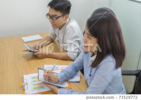 Young Asian office employee working in the office Young Asian office employee working in the office 73529772