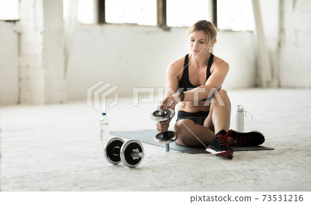 Modern workout during covid-19 at home or gym in self-isolation Modern workout during covid-19 at home or gym in self-isolation 73531216