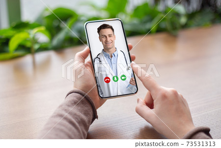 Telehealth Concept. Unrecognizable Female Patient Video Conferencing With Doctor On Smartphone 73531313