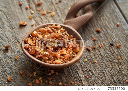 Myrrh resin on a spoon on a table Myrrh resin on a spoon on a table 73532300