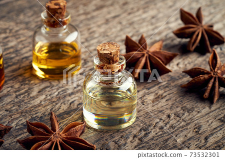 Essential oil bottle with star anise Essential oil bottle with star anise 73532301