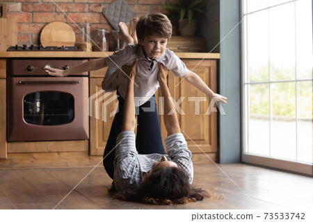 Caring mom have fun playing with little son 73533742