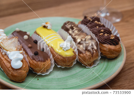 Eclairs with different ganache and icing with different toppings Eclairs with different ganache and icing with different toppings 73533900