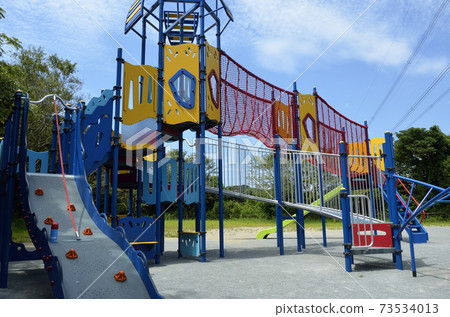 Playground equipment in the park Playground equipment on the hill 73534013