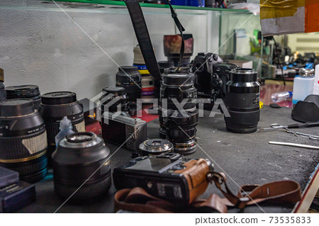 Many lens on table at cleaning camera service room 73535833