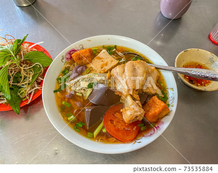 Bun Rieu noodle served at street food market in Vietnam Bun Rieu noodle served at street food market in Vietnam 73535884