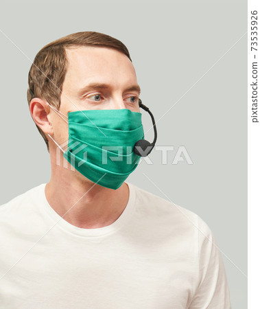 Men in call center. White t-shirt. Headset for telemarketing  73535926