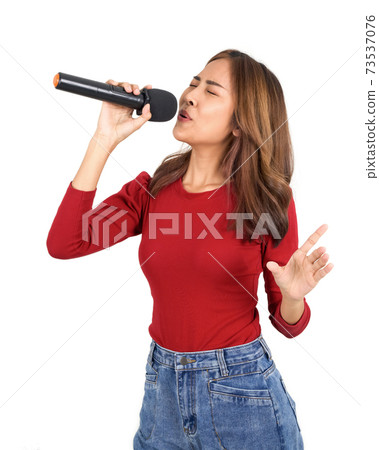 Young asian woman in red long sleeve t-shirt singing with microphone. Portrait on white background with studio light. Young asian woman in red long sleeve t-shirt singing with microphone. Portrait on white background with studio light. 73537076