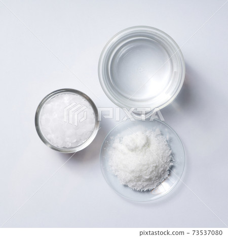 Cosmetic chemicals ingredient on laboratory table. Microcrystalline wax, Potassium chloride (KCl). Cosmetic chemicals ingredient on laboratory table. Microcrystalline wax, Potassium chloride (KCl). 73537080