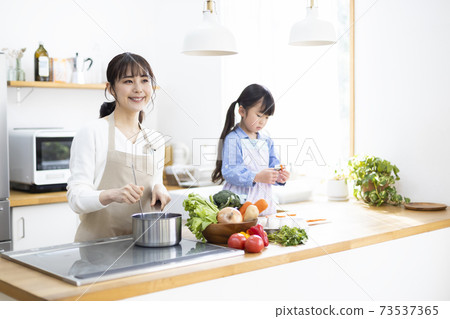 Parents who cook in the kitchen 73537365