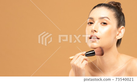 Beauty asian woman hold make up brush and cheerful with make up brush Beauty asian woman hold make up brush and cheerful with make up brush 73540021
