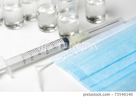 Nobel coronavirus covid-19 vaccine vial a illustrative picture, doctor in the laboratory with a biological tube for analysis and sampling of Covid-19 infectious disea. Nobel coronavirus covid-19 vaccine vial a illustrative picture, doctor in the laboratory with a biological tube for analysis and sampling of Covid-19 infectious disea. 73540140