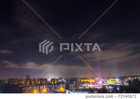 Beautiful light pillars during a freezing winter night 73540971