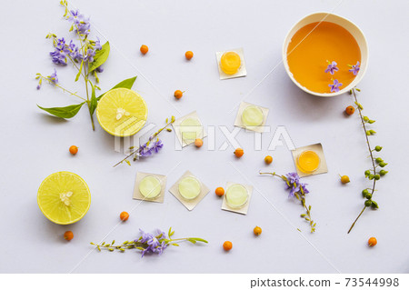 cough sore throat pastille pills from herbal honey and lemon with purple flowers cough sore throat pastille pills from herbal honey and lemon with purple flowers 73544998