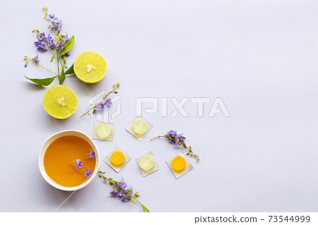 cough sore throat pastille pills from herbal honey and lemon with purple flowers cough sore throat pastille pills from herbal honey and lemon with purple flowers 73544999