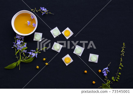 cough sore throat pastille pills from herbal honey and lemon with purple flowers cough sore throat pastille pills from herbal honey and lemon with purple flowers 73545001