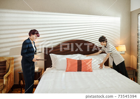 Preparing room for guest 73545394