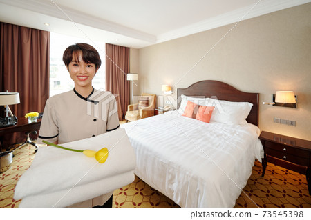 Pretty smiling young maid Pretty smiling young maid 73545398