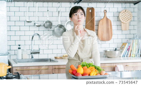Housewives thinking of menu 73545647