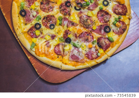 Homemade cheese pizza with salami, delicious pizza with cheddar 73545839