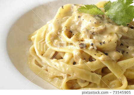 Hot truffle cream flat pasta with trefoil Hot truffle cream flat pasta with trefoil 73545905