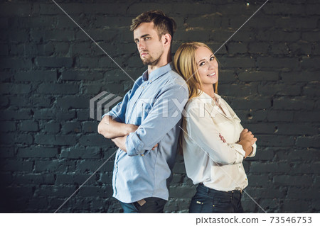 business team male and female formed of young businessmen standing over a dark background business team male and female formed of young businessmen standing over a dark background 73546753