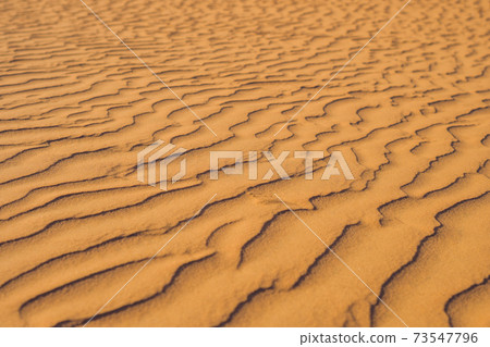 Sand with waves in the red desert Sand with waves in the red desert 73547796