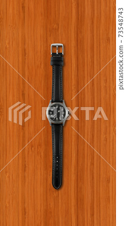 Wrist watch isolated on dark wooden background Wrist watch isolated on dark wooden background 73548743