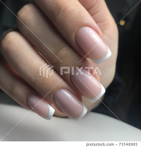 French manicure on the nails. French manicure design. Manicure gel nail polish French manicure on the nails. French manicure design. Manicure gel nail polish 73548985