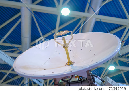 White rotating satellite dish antenna using to receive or transmit information 73549029