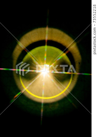 Abstract sun flare. The lens flare is subject to digital correction 73552218