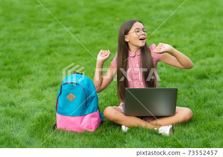 carefree child relax in park on green grass working carefree child relax in park on green grass working 73552457