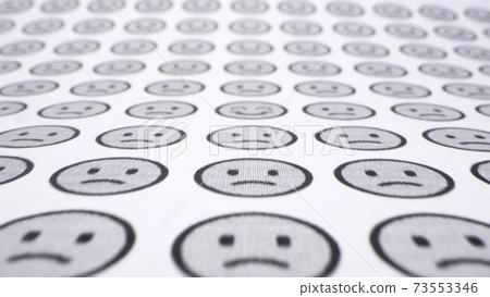 detailed. smilies background. one cheerful smile among many sad ones. 73553346