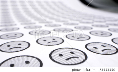 detailed. smilies background. one cheerful smile among many sad ones. detailed. smilies background. one cheerful smile among many sad ones. 73553350