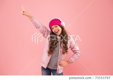 small kid listen music headset. child long curly hair. hair  73553797