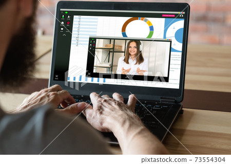 video chat remote conference man colleague laptop 73554304