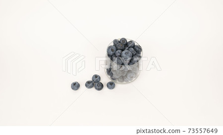 Ripe blueberries in glass close up 73557649