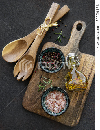 Old wooden kitchen utensils and spices Old wooden kitchen utensils and spices 73559388