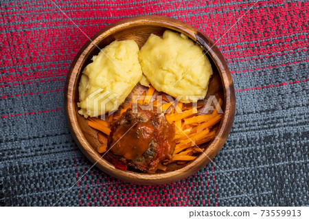 African maize porridge called ugly in bowl. nshima, with meat and sweet potatoes. flat lay African maize porridge called ugly in bowl. nshima, with meat and sweet potatoes. flat lay 73559913