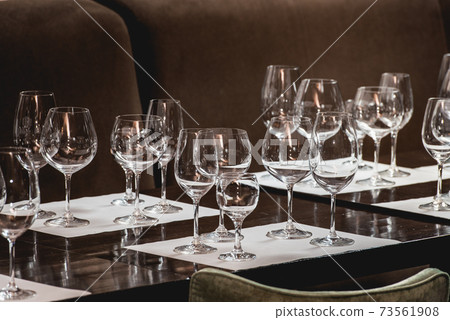 empty glasses of different shapes served for a wine tasting empty glasses of different shapes served for a wine tasting 73561908