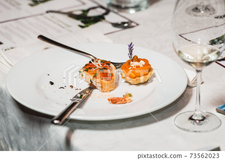 Served table for food and wine tasting. Snacks with shrimp, fish fillets, Spain tapas recipe food pintxos 73562023